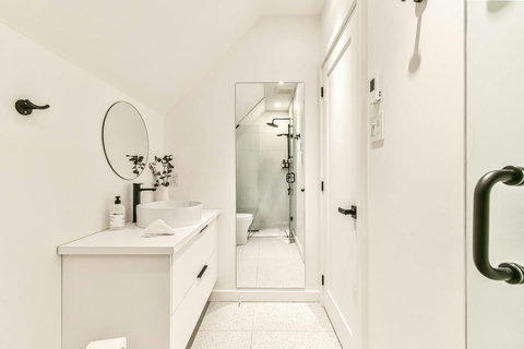 Bright and functional, this upstairs bath is perfect for guests with its clean design.