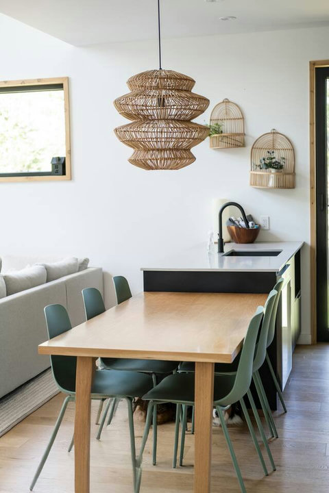 Gather around the modern dining table for meals, games, and memorable conversations.