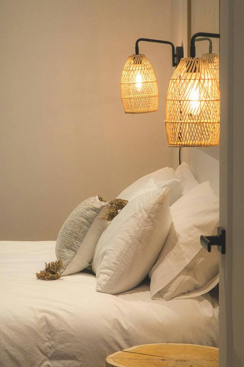 Warm lighting and natural textures set the perfect tone for restful nights.