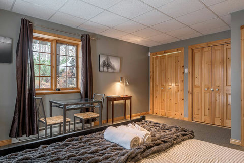 Lower Ground: Bedroom, Queen bed & Dining Table