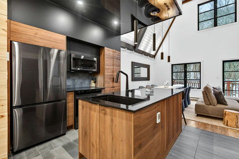 Modern open-concept kitchen with soaring ceilings and stylish finishes