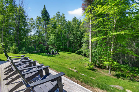 Private wooded yard with sunny deck seating and a cozy fire pit