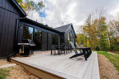 Rear terrace with BBQ and outdoor furniture.

