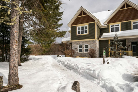 Townhouse Chalet front view in Winter, with path to entrance (shovelled in winter)