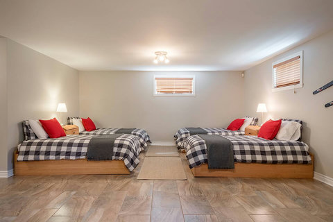 Lower ground floor opened space with 4 single beds and drawers