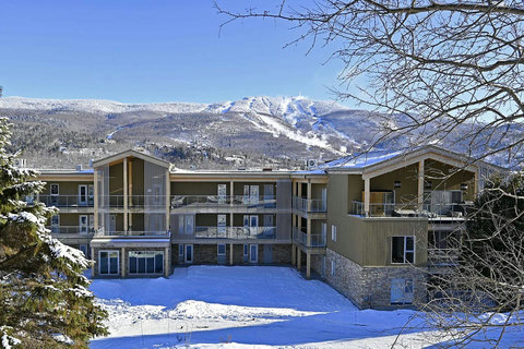 Snowy mountain condo with balconies and stunning ski hill views