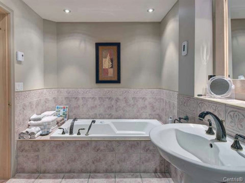 Master bathroom with bathtub and shower 