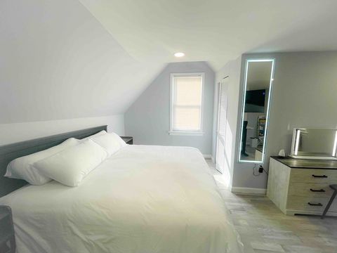 King size bed in a large spacious bedroom. Large walk in closet, LED full length mirror, dresser with led makeup mirror, adjustable stand up desk,  ergonomic chair, independent split air conditioning and heating unit, large 50 inches TV with Apple TV
