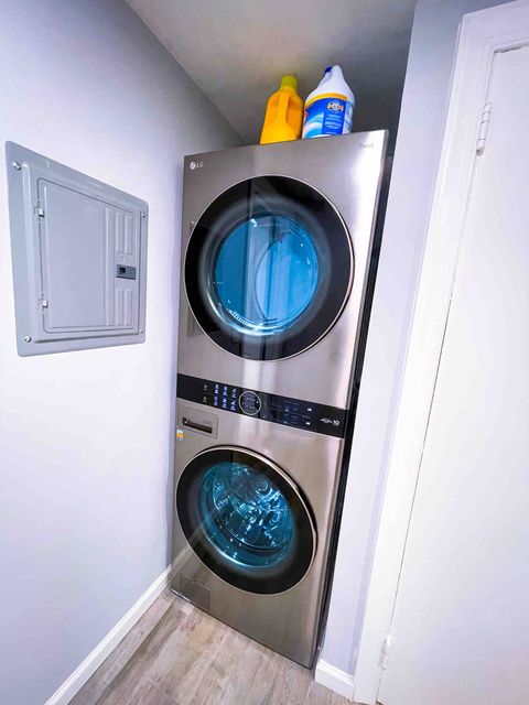 LG Wash Tower high efficient washer and dryer with laundry detergent and bleach.