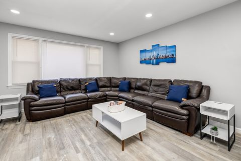 Oversized living room with a large leather sofa that can seat 8-10 people. 65” Samsung LED TV with a sound bar, YouTube TV, Disney+, Hulu, ESPN+, Apple TV+, Prime Videos and more.