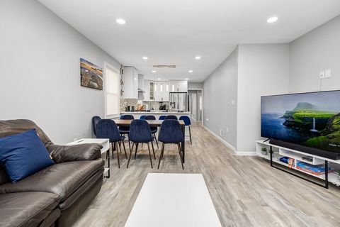 Oversized living room with a large leather sofa that can seat 8-10 people. 65” Samsung LED TV with a sound bar, YouTube TV, Disney+, Hulu, ESPN+, Apple TV+, Prime Videos and more.