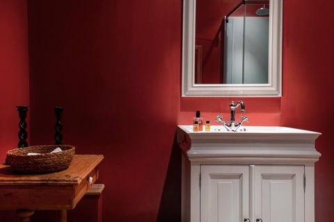 Renovated bathroom with private sink, shower and toilet including utilities such as towels and shampoo.