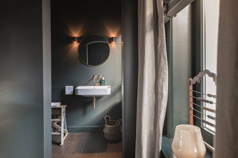 Bathroom entrance with sink, shower, toilet  and utilities. Pictures by Claude Smekens.