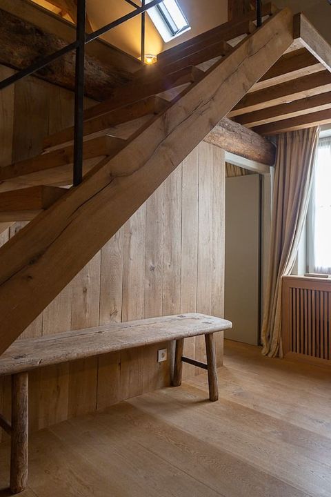 Wooden stairs to second bedroom under the roof.