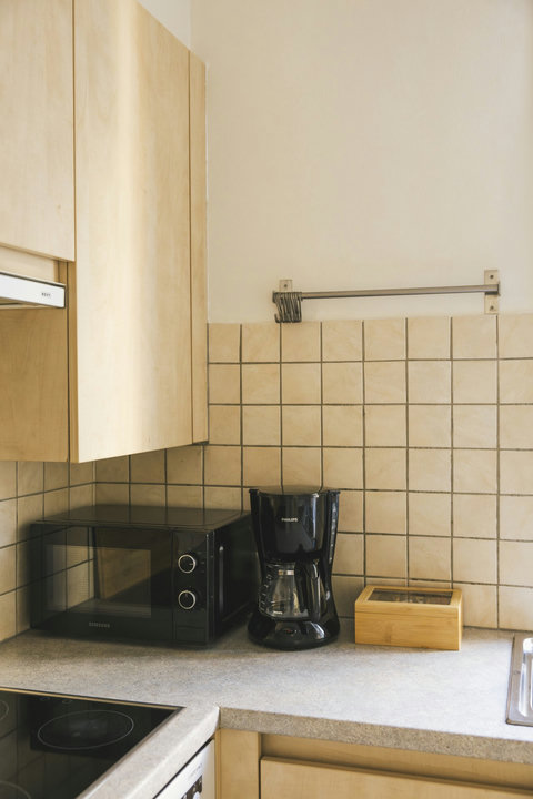Coffee corner with filter coffee maker, microwave and a selection of teas for slow mornings