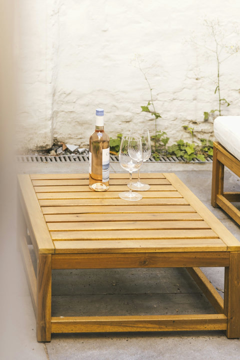 An evening glass of wine in your own private courtyard — city centre location, garden-level calm
