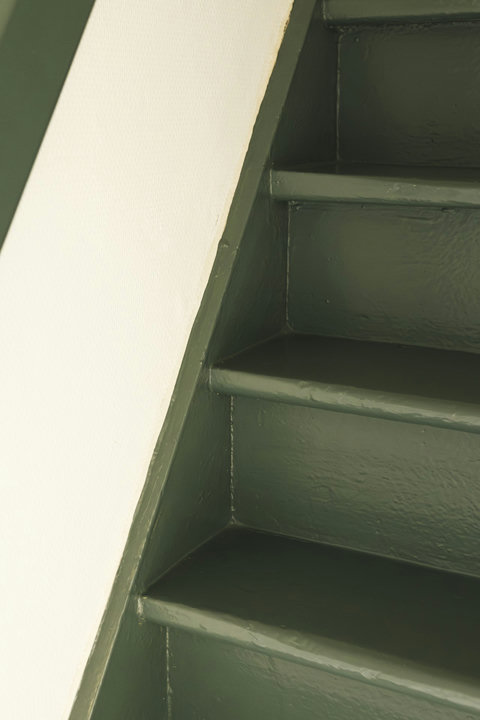 Original painted staircase, one of the many authentic details of this historic home