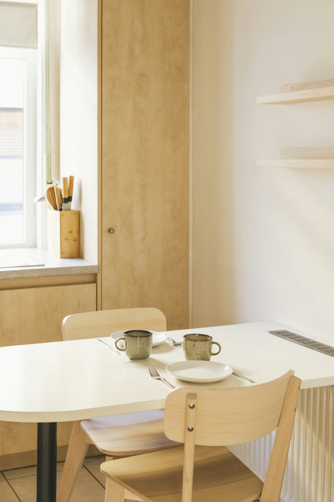 Breakfast table by the kitchen window, set and ready for your first morning in Bruges