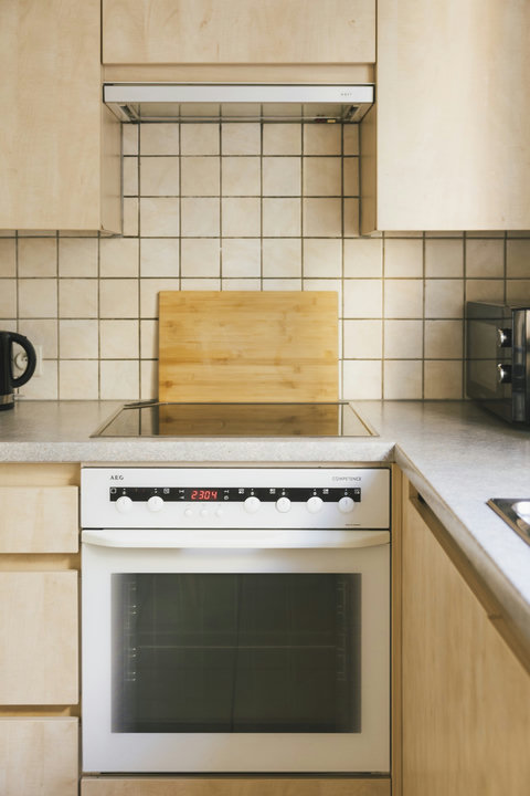 Modern oven and induction cooktop, ready for a home-cooked dinner after a day exploring Bruges