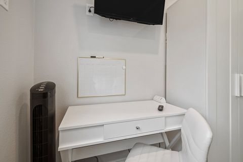 Work desk with charging station and dry erase calendar