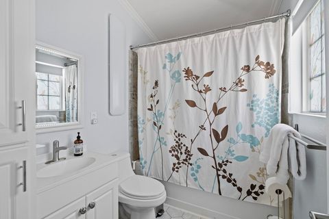 Private bathroom with cabinet storage and under-sink storage