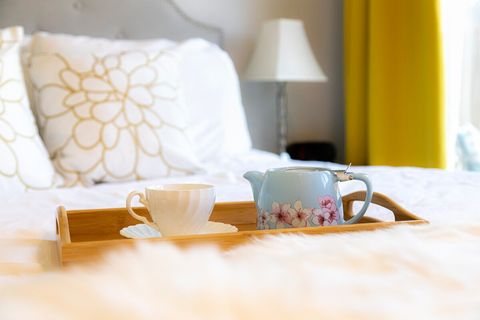 Relax in a cozy queen-size bed with 100% cotton sheets, mattress topper, and both firm and soft pillows