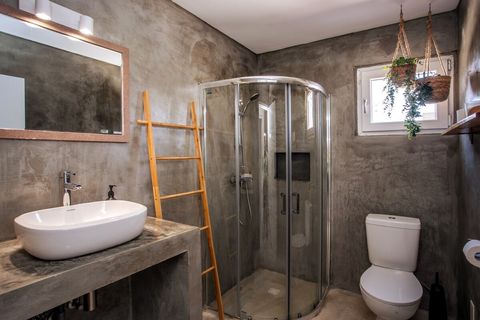 Second bathroom complete with sink, shower and toilet.