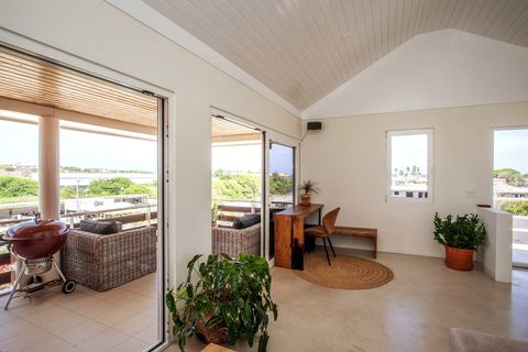 Large open living space with large doors to the balcony.