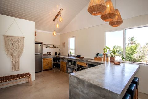 Large kitchen with all needed kitchen supplies and bar.