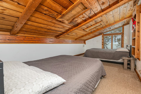 loft bedroom with 2 queen beds