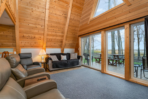large windows overlooking deck from living area