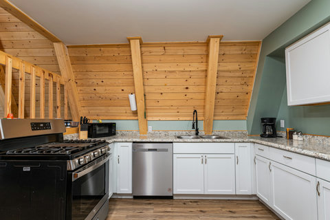 Kitchen with dishwasher, fridge, Range and microwave