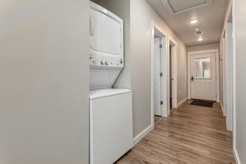 Hallway with laundry faucilicties