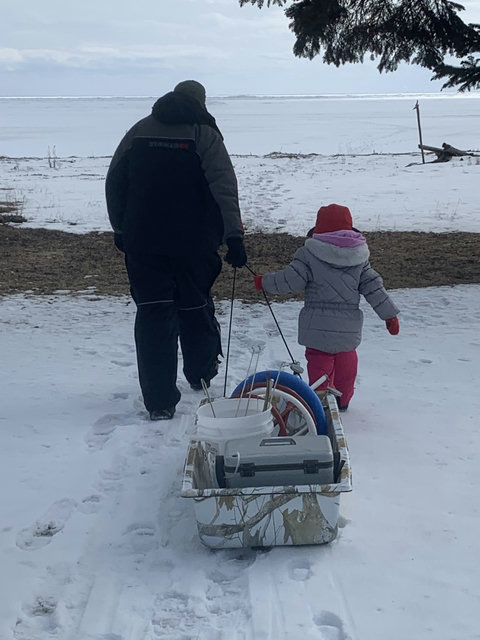 Family heading out on the ice making memories