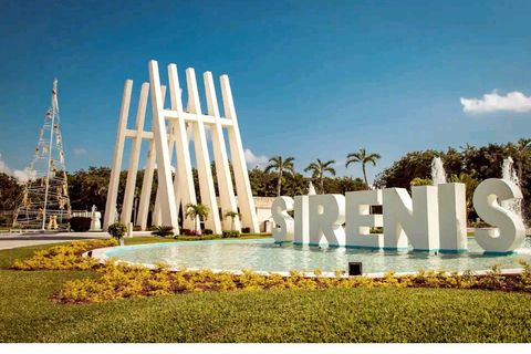 Enter the gated resort of Grand Sirenis where the condo building is located.