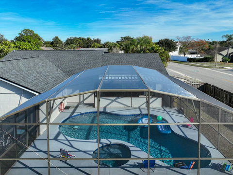 Heated Pool and Spa/Jacuzzi with toys floating devices,  beach chairs and mosquito net fence for confort.