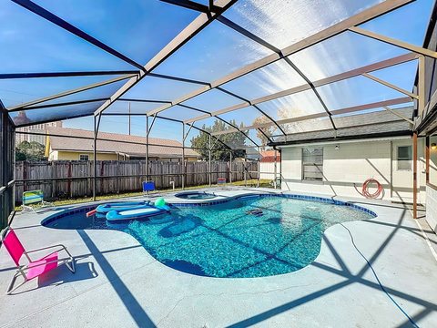 Heated Pool and Spa/Jacuzzi with toys floating devices,  beach chairs and mosquito net fence for confort.