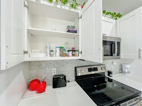 Fully equipped kitchen with dishwasher, oven, microwave, Fridge, Silverware, Pans pots, cups, dishes, seasonings, filtered water in fridge, coffee machine, espresso machine and coffee provided, toaster.