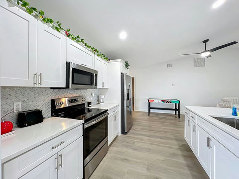 Fully equipped kitchen with dishwasher, oven, microwave, Fridge, Silverware, Pans pots, cups, dishes, seasonings, filtered water in fridge, coffee machine, espresso machine and coffee provided, toaster.