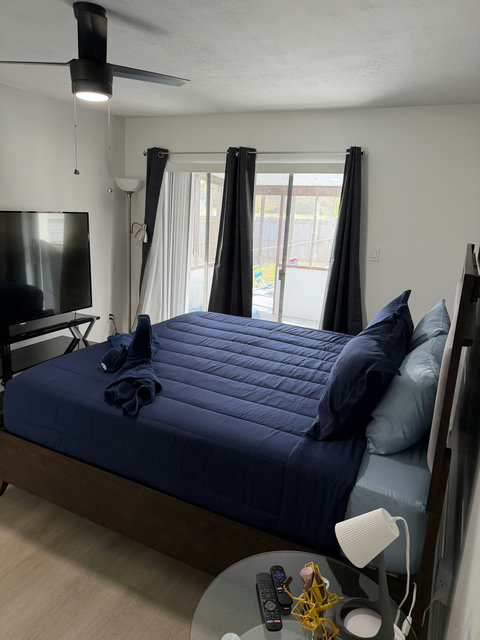 Master bedroom with King bed with full bathroom attached, closet, direct pool access from the room, smart Tv, Printer, Board games, Bidet in toilet, Crib inside closet.