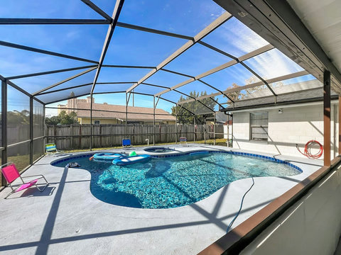 Heated Pool and Spa/Jacuzzi with toys floating devices,  beach chairs and mosquito net fence for confort.