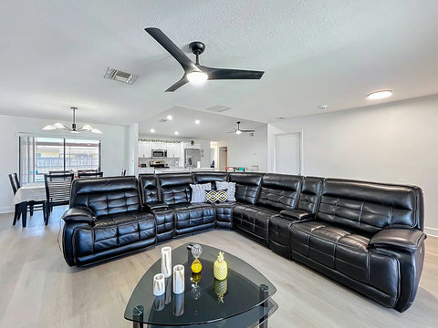 Leather sofa with three recliners wireless charging, cup holders usb ports- usbc Storage , Smart Tv with Xbox gaming console.