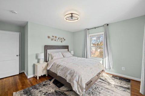 Bedroom 2 has a queen bed. The home sleeps up to 5 guests across two queen bedrooms and one single bedroom.