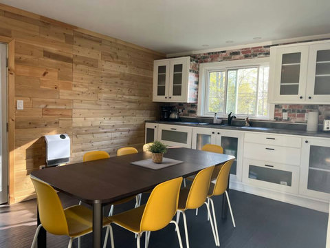 Fully equipped kitchen with dining area.