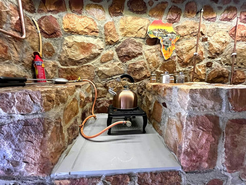 Private entrance to a fully equipped kitchenette with gas stove, fridge/freezer, microwave, essential crockery, utensils and cookware. Best of all, enjoy an easy-to-use craft coffee machine for your perfect morning brew.