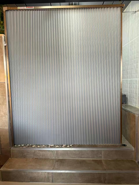 A folding door separates the bathroom from the bedroom, providing practical privacy. Two small steps are need to access shower and toilet. 