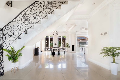 Grand entry view with open layout connecting the dining area and main living spaces.