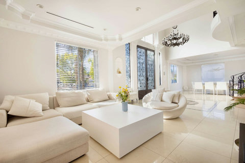 Bright and spacious living room with comfortable seating and natural light.