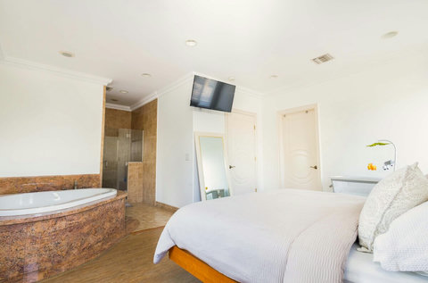 Relaxing spa tub inside the master suite bathroom, perfect for unwinding after a long day