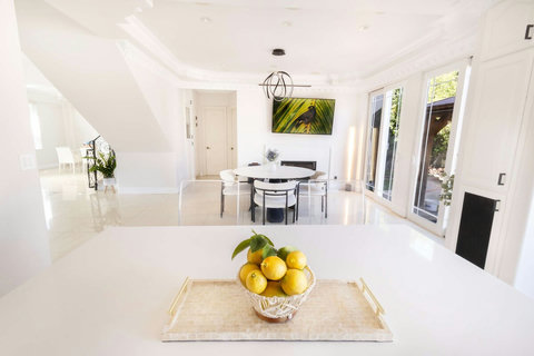 View from the kitchen overlooking the event and gathering space with access to the backyard.